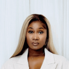 Samona ‘Mink’ Gaudet looking at the camera against a white background.